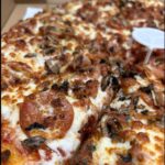 Cheesy pizza just waiting to be your dinner.